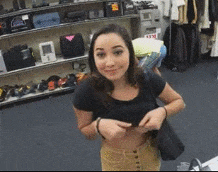 Cute girl flashing tits in pawn shop