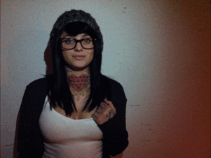 emo hipster babe with glasses flashing star tattoo boob