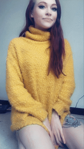 I've got a surprise under this big yellow sweater