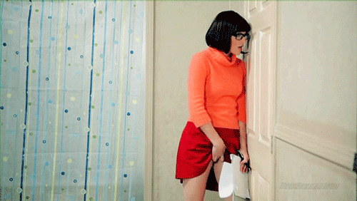 Velma from Scooby Doo spying