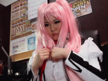 Gif - Asian babe in cosplay showing off her big tits.