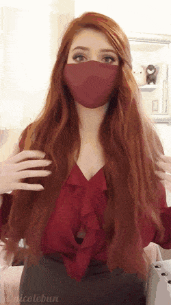 Gif - Busty masked redhead shaking her tis out