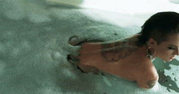 Gif - Christy Mack gets out of the water in a bathing suit with her big plump ass