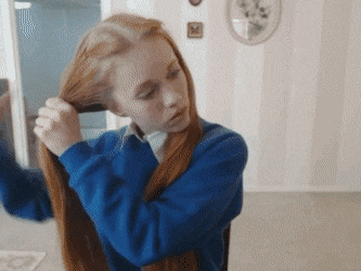 Gif - Dolly Little does her pigtails