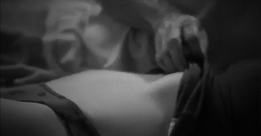 Gif - Pulling up her shirt and touching her
