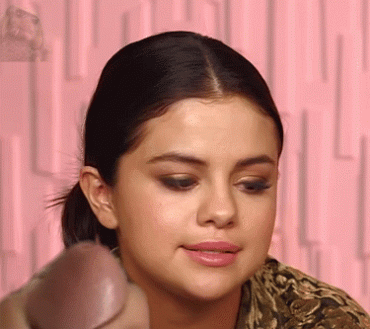 Gif - Selena Gomez takes a load to the face