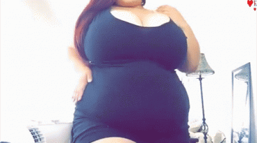 Gif - Black dress BBW teases with her body