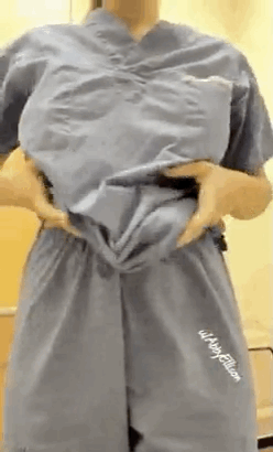 Gif - Nurse squeezing her big boobs together