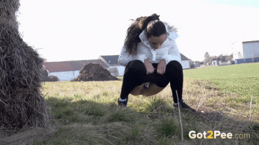 Gif - Vinna Reed relieving her pee desperation in front of a farm