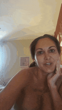 Gif - MILF On The Bed Chatting With Big Natural Tits