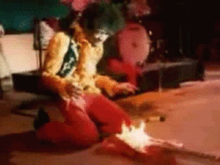 Gif - The greatest guitarist ever born creating never ever reproduced sounds by lighting his guitar on fire.